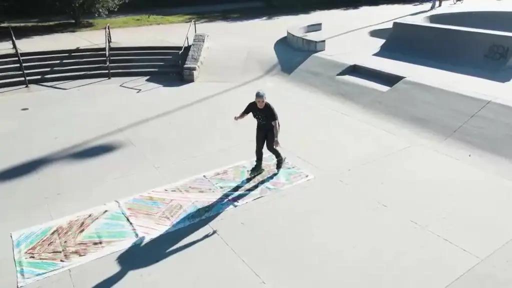 Jean Cherouny paints on rollerblades. Really.
