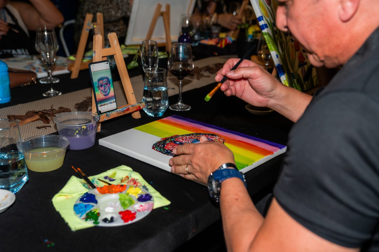 A guest painting at ArtTable 2026